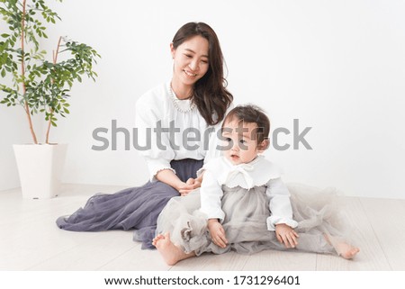 Baby playing with mom at home
