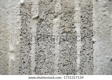 The surface of the concrete wall is made unfinished for the background.