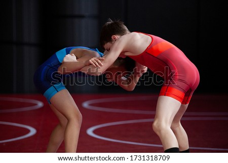 Youth wrestlers hand fighting in the neutral position on their feet