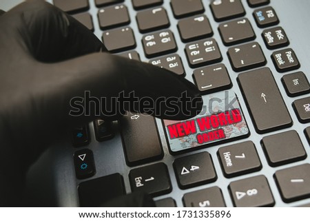 Hand in gloves waiting to press the button new world order on keyboard, concept for reopening business after covid-19 coronavirus