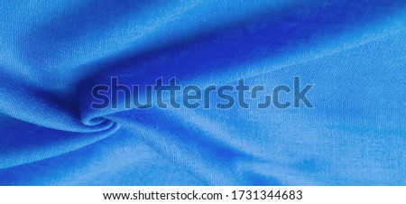 Texture. Background fabric of silk blue matte color, (paint or surface) is dull and flat, without shine.