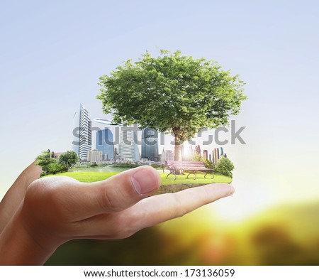 human hand holding the city  Royalty-Free Stock Photo #173136059