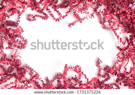 Violet red Tinsel or papers on white background. Copy space