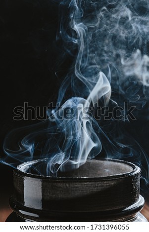 Different white smoke textures on black background