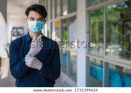 Office personnel wear medical masks and medical gloves. To prevent the spread from the corona virus. Royalty-Free Stock Photo #1731399634