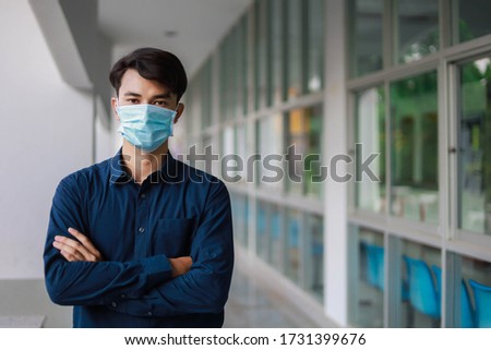 Office personnel wear medical masks to prevent the spread from the corona virus. Royalty-Free Stock Photo #1731399676