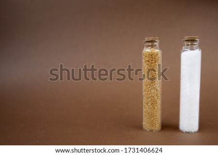 Sugar and salt for bathroom. Copy space. Place for text and design. Brown background.
