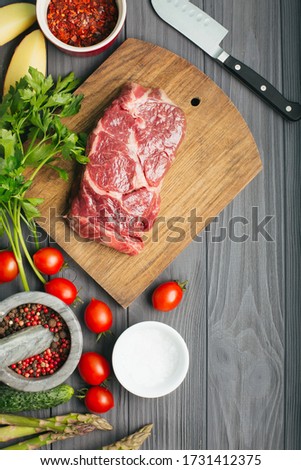 Raw steak, marbled beef, meat, dark background