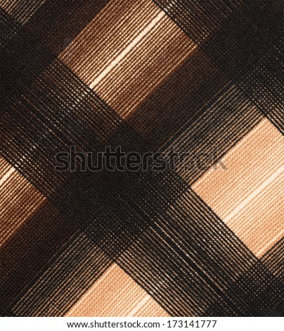 Close up of real wool and cotton fabric texture in brown tone or shade color with highlighted backdrop. Fashion design background theme