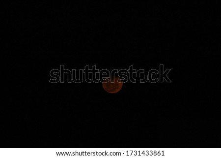 Moon at night with reddish