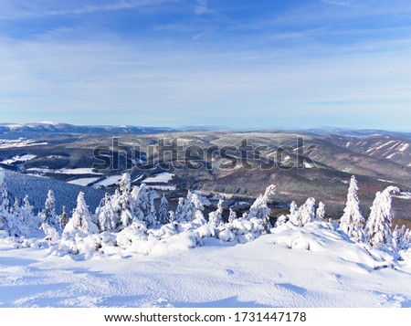 Beautiful view over the top of snow covered Serak mountain in Czech Republic Royalty-Free Stock Photo #1731447178