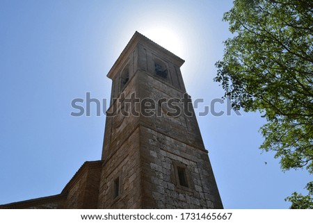 tower under the sun, beautiful picture of the blue sky and the sun behind the tower