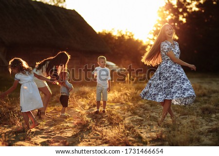 happy young moms playing with their kids outdoors in summer. Happy family time together concept. selective focus.