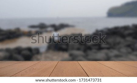 Empty Wood Plate Top Table On Beautiful Sea , Sand and Sky Backg