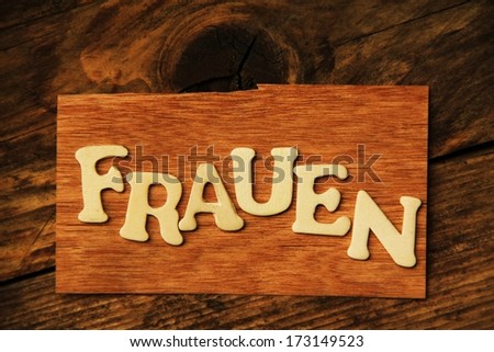 the German word FRAUEN ( Women ) on wood 