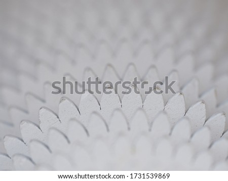 White background. Abstraction. Concentric wooden circles similar to gears.