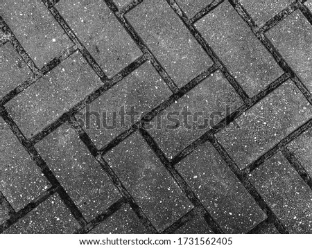 Black and white retro photo of an old street tiles