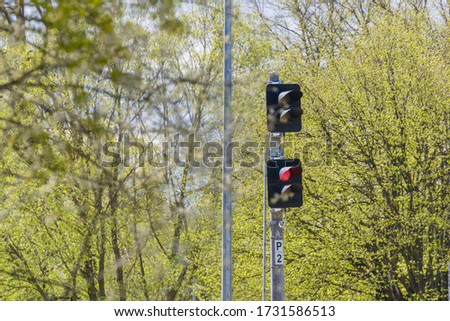 Railway traffic light at the station. train control. Railway semaphore for the movement of trains are lit in red.