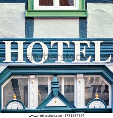 Hotel signboard on an old half-timbered house.