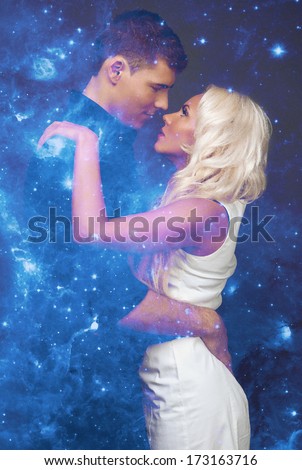 Magic love story. Love and stars in space dreams.  Man and woman on a background of space planet, galaxies, star systems. Fantastic couple. Witchcraft, star witch. 