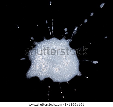 Human saliva or spit on black background in a concept for new coronavirus tests using mucus instead of nasal swab Royalty-Free Stock Photo #1731665368