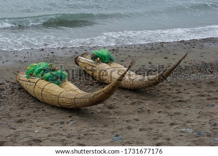 Artisanal fishing reed horses on the Huanchaco beach in La Libertad-PERU