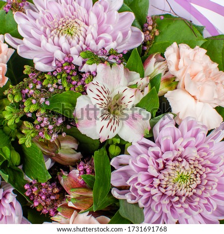 Bouquet of flowers from red roses and chrysanthemums. Close-up, top view