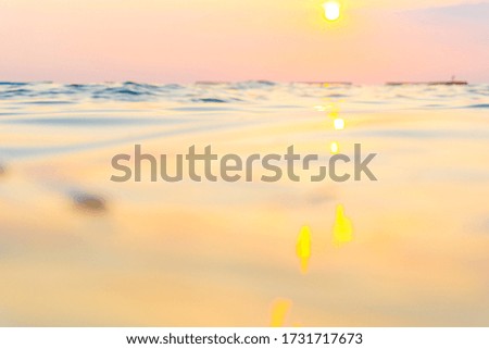 Abstract blurred sea wave bach sunset warm light new hope concept