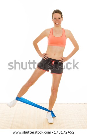 beautiful aerobic trainer is showing gymnastic exercises with a 