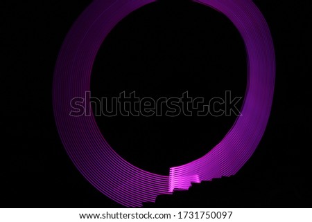 abstract neon lines, abstraction, graphics. multicolored abstract lines on a black background.