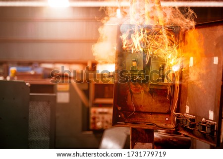 Short circuit and damaged blown electricity breaker from high voltage overload, old grunge messy fuse box and bad installation fire burn fuses over heat. Royalty-Free Stock Photo #1731779719