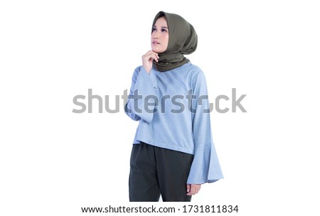 Beautiful Hijab woman is posing looking up and hoping