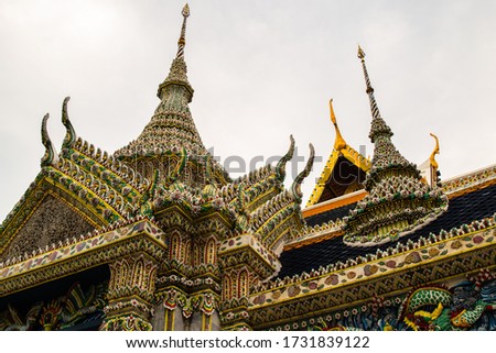 Bangkok, Thailand - January 25, 2016: Inner temples of Grand Palace in Bangkok, detail of traditional ceramic colorful roofs