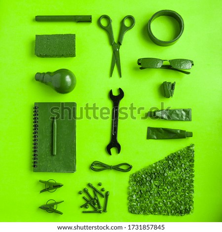 Green monochromatic photo green painted pen scissor bulb glasses book etc makes beautiful background