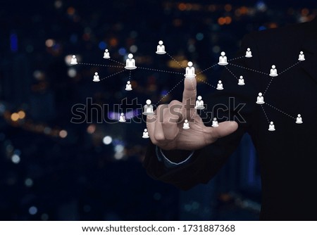 Hand click businessman flat icon with connection line over blur colorful night light modern city tower and skyscraper, Business communication concept