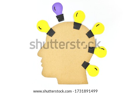 Thinking outside the box, new business idea and set trend concept. Human male head profile silhouette with light bulb. 