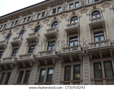A low angle shot of a building with balconies