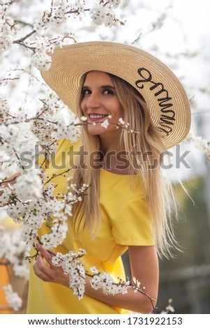 portrait of woman in bloom cherry tree