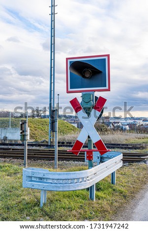 Unrestricted level crossing with St. Andrew's Cross.