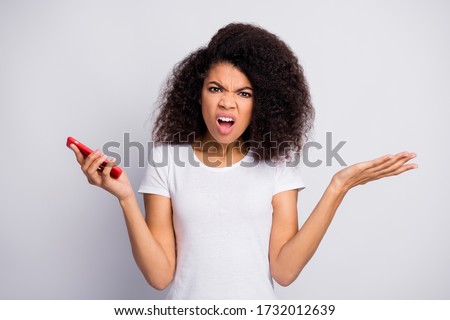 Close-up portrait of her she nice attractive lovely outraged irritated ignorant wavy-haired girl using gadget smm fake news browsing isolated over light white pastel color background Royalty-Free Stock Photo #1732012639