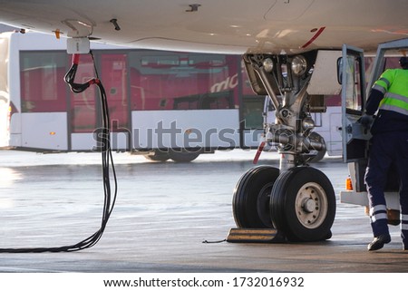 Maintenance of passenger aircraft before departure at the airport after a long downtime. The resumption of passenger traffic. Pre-flight training, checking aircraft systems. Technical Royalty-Free Stock Photo #1732016932