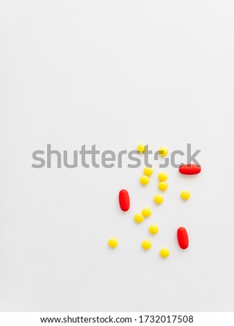 An overhead shot of some medicaments on  a gray background