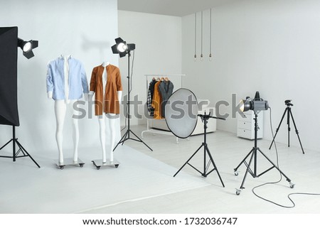 Ghost mannequins with modern clothes in professional photo studio