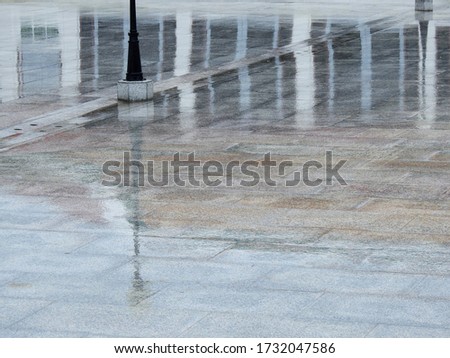 wet floor with water reflection after rain in temple at Thailand