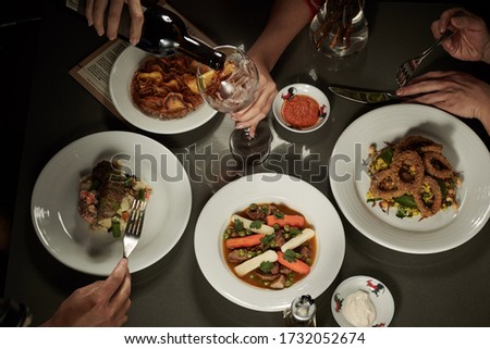 Table served with many dishes for share Royalty-Free Stock Photo #1732052674