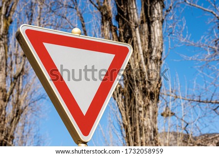 Close-up of a Yield or Give Way Road sign. Photography, Trento city, Italy, Europe