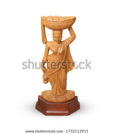A Small Size Wooden Statue of lady Holding Basket on Her Head - Showpiece - Isolated Royalty-Free Stock Photo #1732112911
