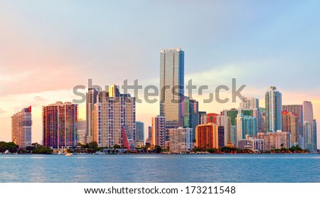 City of Miami Florida, night skyline. Cityscape of residential and business buildings illuminated at sunset  