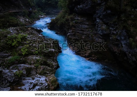 Beautiful little river flowing between rocks in Vintgar Gorge, Slovenia. Mystical water picture in soteska. 