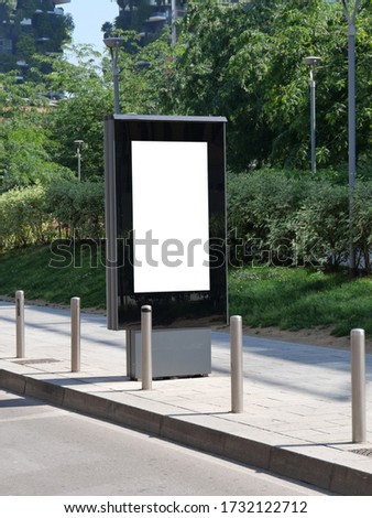 Sign mockup in the street. White billboard. White poster mupi. Large Outdoor White Blank Advertisement Banner Mock Up with with Frame in City. Isolated Template 